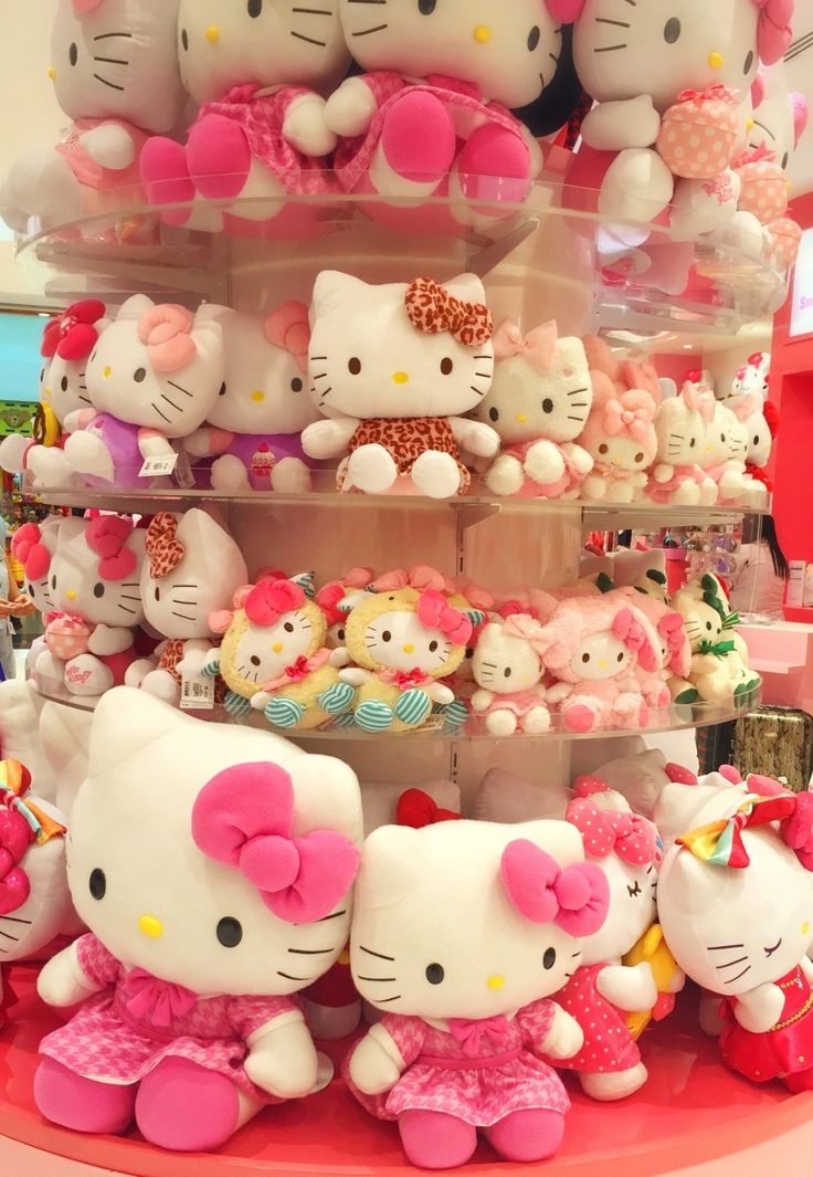 there are many hello kitty toys on display