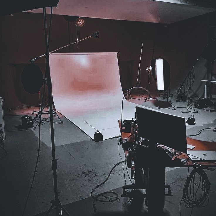 an empty photo studio with lighting equipment