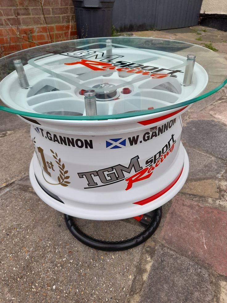 a glass table sitting on top of a sidewalk