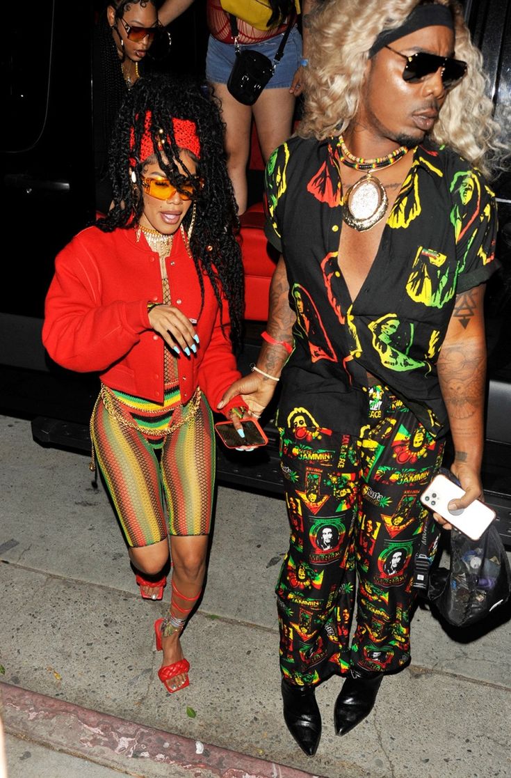 two women walking down the street in matching outfits