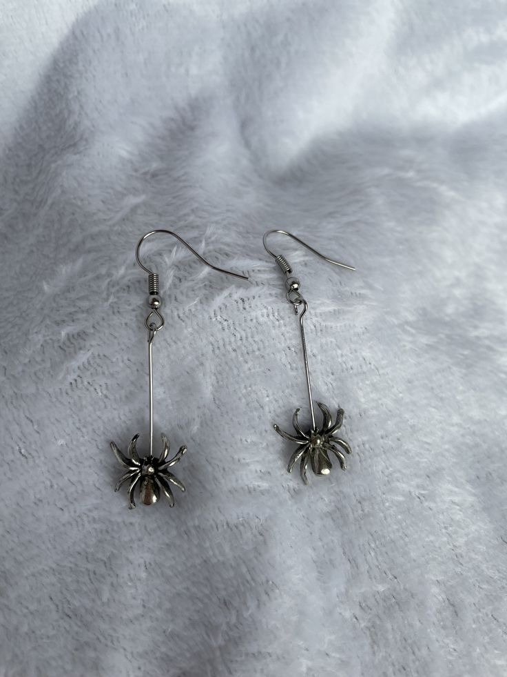 Spider earrings on stainless steel earring hooks. Great for Halloween, Samhain, or just because! Very fun addition to your outfit. Spend $35 or more at this shop for free shipping. Novelty Hypoallergenic Earrings For Party, Novelty Hypoallergenic Party Earrings, Hypoallergenic Novelty Earrings For Party, Hypoallergenic Novelty Party Earrings, Nickel-free Punk Halloween Earrings, Nickel-free Punk Earrings For Halloween, Punk Nickel-free Earrings For Halloween, Punk Style Nickel Free Earrings For Halloween, Trendy Halloween Dangle Earrings