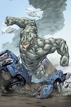 an image of a man riding on the back of a blue car in front of a monster