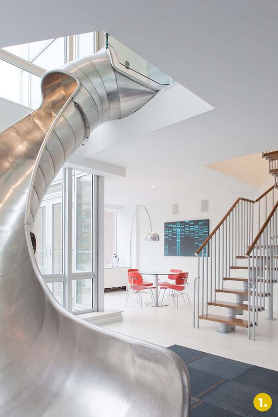 a slide in the middle of a living room