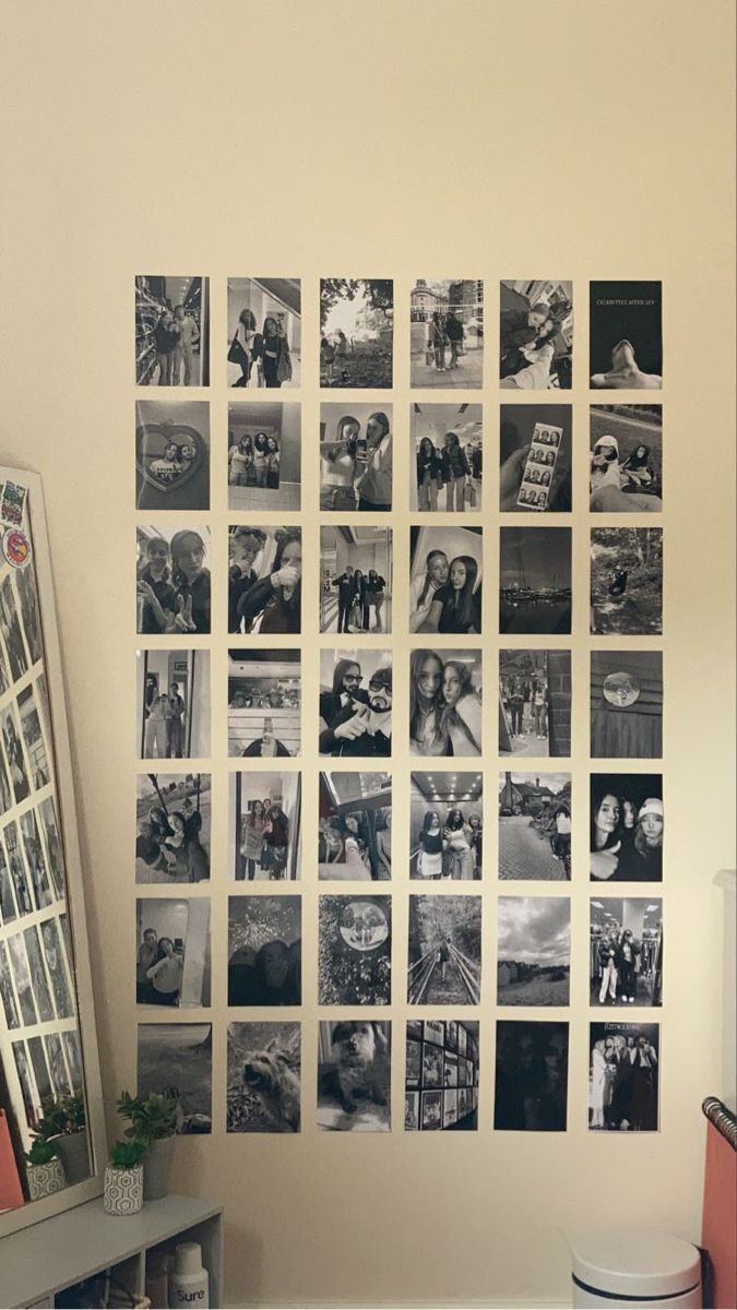 a bunch of pictures are hanging on the wall