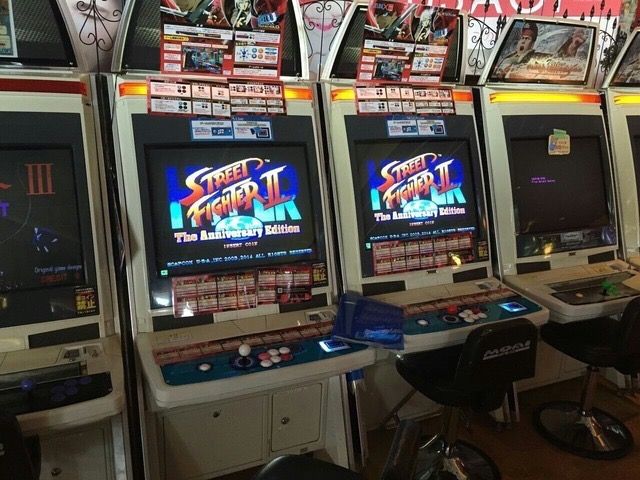 several video game machines lined up in a row