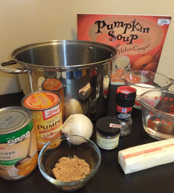 an assortment of ingredients for pumpkin soup sitting on a table