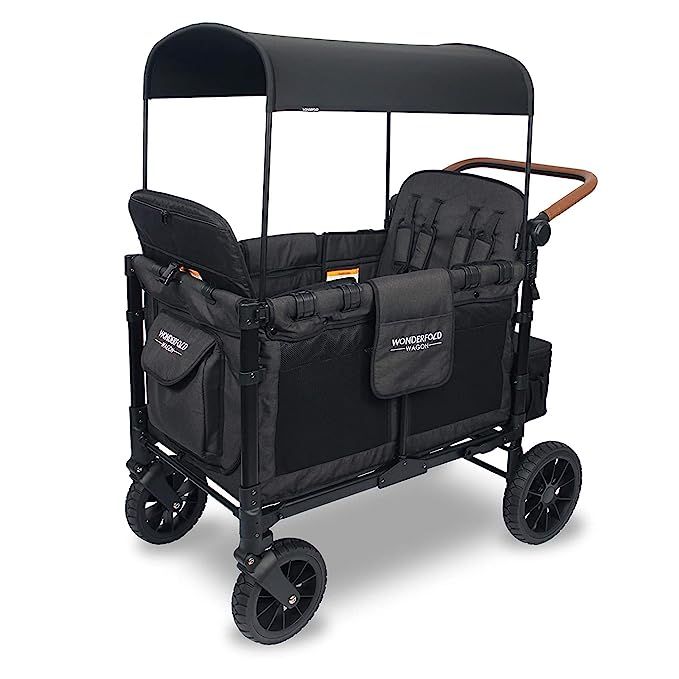 a stroller with two wheels and an umbrella on the top, is shown in black