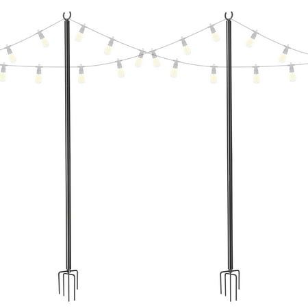 three black poles with lights on them and one pole has two forks attached to it