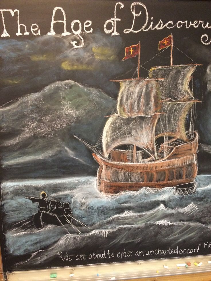 a chalk board with an image of a pirate ship in the ocean and another boat on it