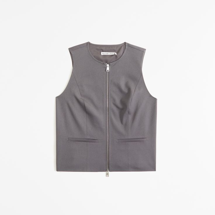 Elevate your wardrobe with the A&F Mara Zip-Up Vest, a perfect blend of style and comfort. This vest is designed for the modern woman, featuring a chic dark gray color that complements any outfit.

- Size: XS
- Color: Dark Gray
- Material: Polyester, Viscose, Elastane
- Gender: Female
- Features: Zip-up front, on-trend seaming details, front pockets

Crafted from a soft synthetic blend, this vest offers both warmth and flexibility, making it ideal for layering over your favorite shirts and blous Fitted Fall Vest With Zipper Closure, Fitted Vest With Zipper Closure For Fall, Chic Vest With Zipper Closure, Zipper Closure Sleeveless Vest For Work, Casual Fitted Vest With Zipper Closure, Sleeveless Workwear Vest With Zipper Closure, Chic Workwear Tops With Zipper Closure, Chic Tops With Zipper Closure For Work, Spring Fitted Vest With Zipper Closure