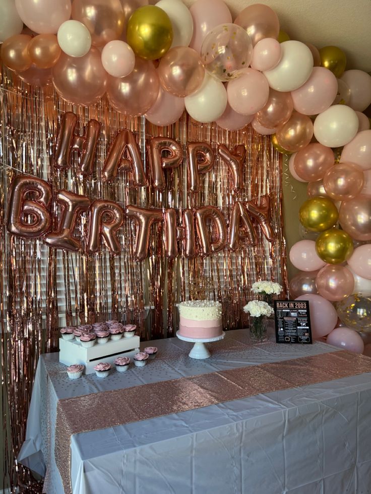 a birthday party with balloons, cake and decorations