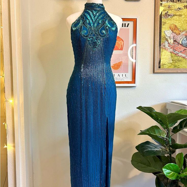 Channel Those Iconic Y2k Red Carpet Vibes With This Stunning Deep Blue Beaded Mermaid Dress! This Show-Stopping Vintage Piece Features Intricate Beadwork, A Chic High Neck, And A Daring Low Back, Perfect For Those Who Love A Bit Of Drama. Features: Size: 4 Waist: 13 Inches (26 All Around) Hips: 17 Inches (34 All Around) Length: 48 Inches With Hem, 51 Without It Condition: In Good Vintage Condition! The Couple Flaws Have Been Shown. A Few Missing Sequins And A Row Of Beads In The Front. The Bottom Of The Dress Was Hemmed Shorter But It Is A Super Easy Fix Of Cutting Those Threads If You Want It Longer! High Neck With All-Over Beaded Detailing Sultry Low Back For A Sleek, Sexy Look Y2k Red Carpet, Beaded Mermaid Dress, Iconic Y2k, Beaded Mermaid, 90s Dress, Mermaid Dress, Low Back, Formal Wear, Deep Blue