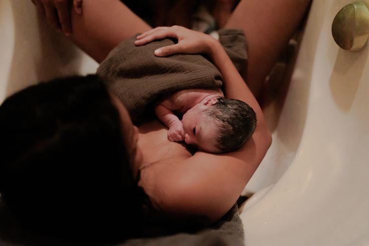 mom holding newborn in bath tub after water birth at home Water Birth Photography, Home Birth Photography, Birth At Home, Magical Water, Water Birth, Birth Photographer, Birth Photography, Home Birth, Photography Pricing