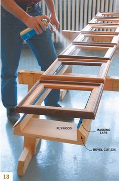 a man is working on some wooden furniture