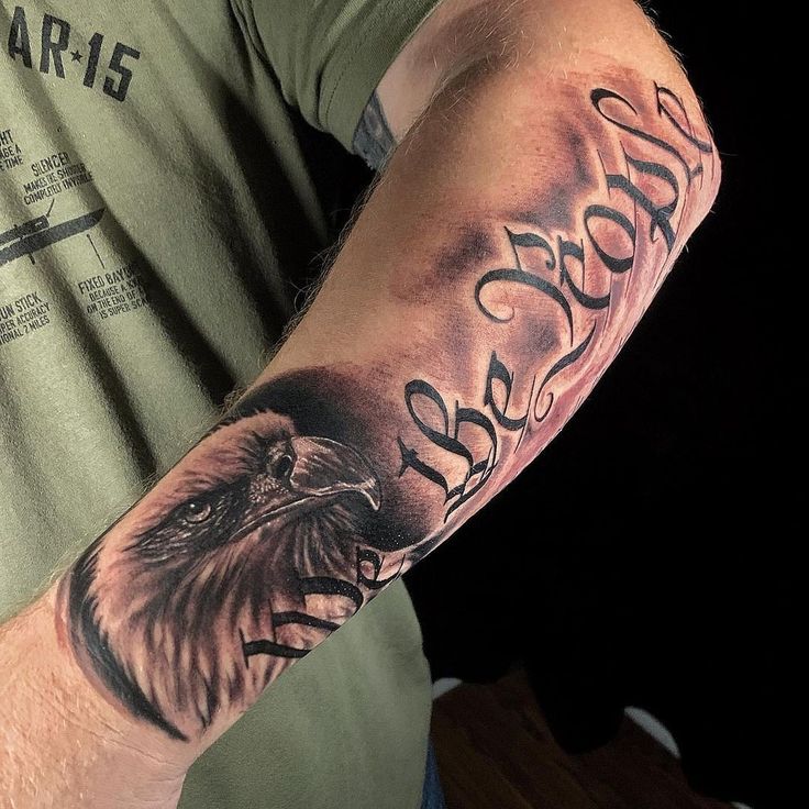 a man with an eagle tattoo on his arm