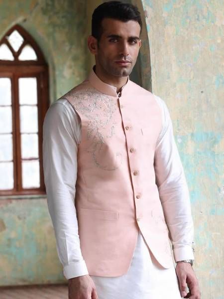 <p><strong>Waistcoat<br /></strong>Color: Baby pink<br />Fabric: PC Suiting Fabric<br />Smart looking waistcoat features fully embroidery work accent the front<br />Fanciful front button closure<br /><br /><strong>Inner:</strong><br />Comes with off-white kurta and pajama<br /><br /><strong>Additional Accessories:<br /></strong>Peshawari Sandal / Khussa: <strong>US$30</strong><strong><br /></strong></p> Sleeveless Nehru Jacket With Resham Embroidery For Eid, Spring Cotton Nehru Jacket With Zari Work, Spring Fitted Dabka Sherwani, Sleeveless Embroidered Bandhgala For Festive Season, Festive Embroidered Sleeveless Bandhgala, Festive Sleeveless Embroidered Bandhgala, Fitted Nehru Jacket With Zari Work For Spring, Unstitched Cotton Nehru Jacket For Spring, Traditional Spring Nehru Jacket With Dabka