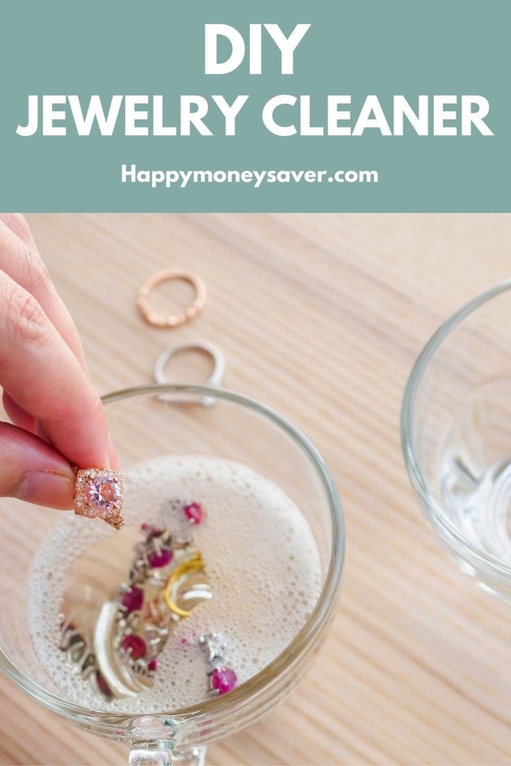 someone is holding their jewelry in a wine glass with the words diy jewelry cleaner on it