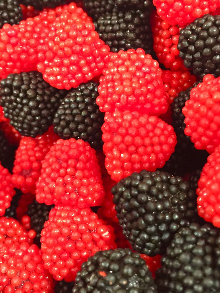 closeup of black and red raspberries on display