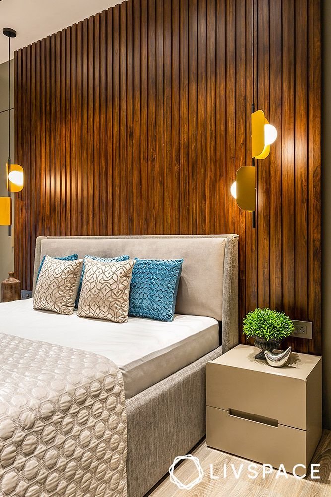 a modern bedroom with wood paneling on the wall