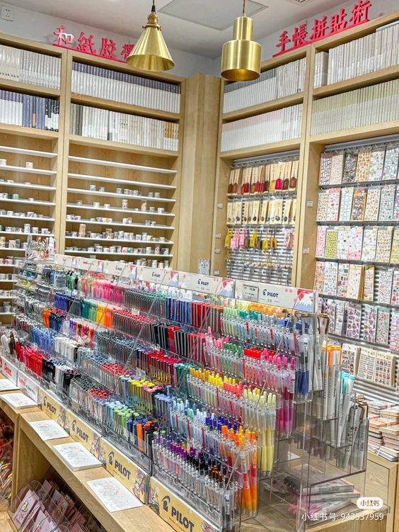 the inside of a store filled with lots of different types of pens and pencils