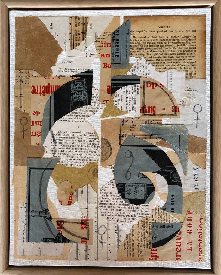 a collage of different types of paper on a piece of wood framed in a wooden frame