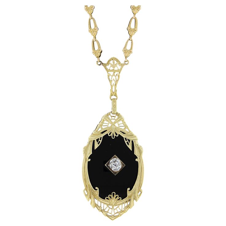 Very Rare to find these necklaces in yellow gold! Most were made in white and platinum. The yellow gold and black onyx combined with the masterful Art Deco Workmanship is truly something special! Enjoy! --Stone(s):-- (1) Natural Genuine Black Onyx - Oval Cut - Prong Set - Rich Black Color - 24x18mm (approx.) (1) Natural Genuine Diamond - Old Mine Cut - Prong Set - 0.22ct (approx.) Total Carat Weight: 0.22 (approx.) Material: Solid 14k Yellow Gold Weight: 8.8 Grams Chain Type: Fancy Link Chain Ch Oval Fine Jewelry Necklace With Intricate Design, Art Deco Pendant Necklace For Formal Occasions, Elegant Gemstone Necklace For Collectors, Collectible Yellow Gold Necklaces With Intricate Design, Evening 14k Gold Jewelry With Black Enamel, Elegant Necklaces With Intricate Design For Collectors, Elegant Collectible Necklaces With Intricate Design, Elegant Intricate Collectible Necklaces, Elegant Intricate Design Necklaces For Collectors