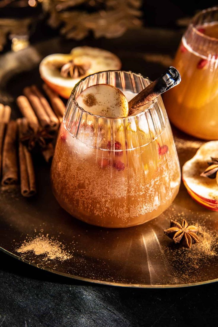 an apple cider with cinnamon and apples in it