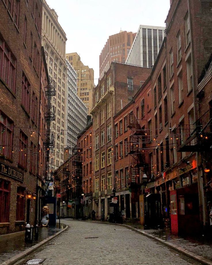 an empty city street with buildings on both sides