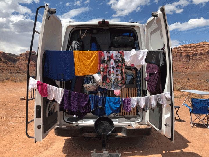 an open van with clothes hanging out to dry