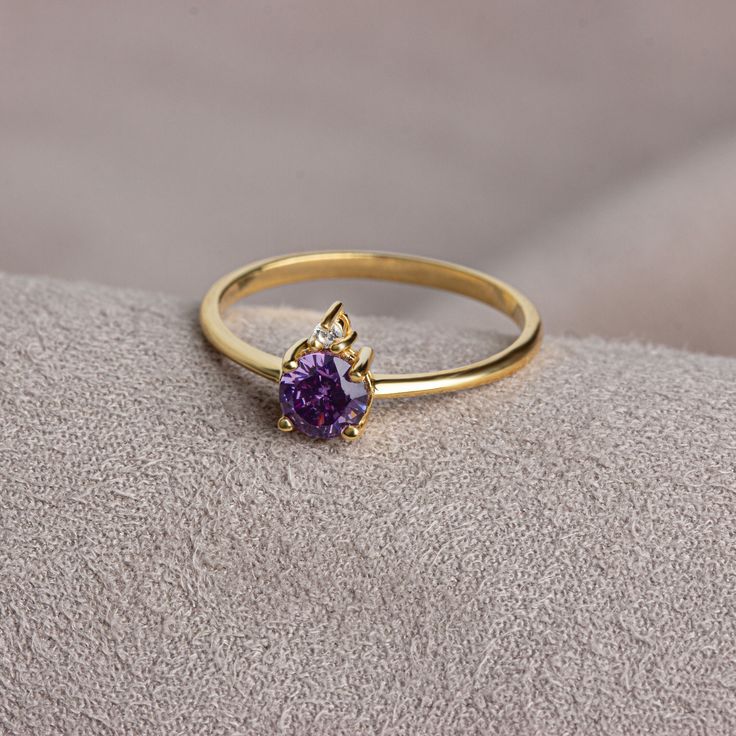 Amethyst helps to reduce stress, increase attention and concentration, and provide emotional balance. Amethyst is the birthstone for those born in February. Meet the essence of elegance: Solitaire amethyst ring. Handcrafted with precision, this exquisite piece features a majestic sapphire set in a magnificent design. A symbol of timeless beauty, it embodies sophistication and elegance. Elevate your style with this breathtaking masterpiece. A stylish jewel for you and your loved ones. Time to pam Elegant Purple Birthstone Ring With Accent Stones, Purple Diamond Ring With Birthstone, Dainty Amethyst Gemstone Ring For Formal Occasions, Gold Heirloom Amethyst Birthstone Ring, Elegant Gold Amethyst Birthstone Ring, Elegant Amethyst Birthstone Crystal Ring, Heirloom Gold Birthstone Ring With Amethyst, Elegant Purple Birthstone Ring With Center Stone, Elegant Purple Diamond Birthstone Ring