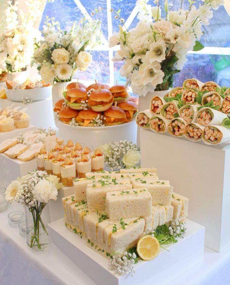 an assortment of desserts and pastries displayed on a table