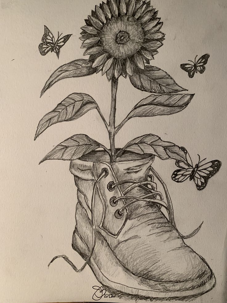 a drawing of a boot with a sunflower in the middle and butterflies around it