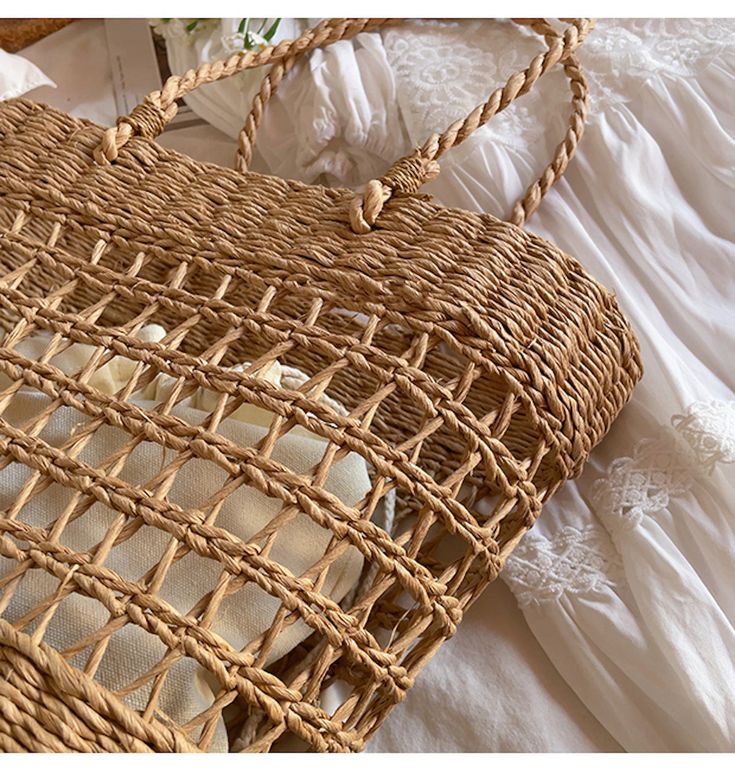 An artisanal basket of hand-woven straw basket bag. Perfect for this summer! Shoulder or top handle carry. Its light weight and durable construction make it ideal for carrying items for a day at the beach or a special event. Show off your style and make a statement with this unique tote bag. Size: 37cm wide opening x 25cm tall (14in x 10in) Designer Style ID: 8439 Basket Beach Bag Made Of Natural Fiber For Vacation, Eco-friendly Open Weave Straw Bag For Summer, Eco-friendly Rectangular Open Weave Straw Bag, Casual Braided Basket Beach Bag, Trendy Summer Basket Straw Bag, Casual Crochet Basket Bag With Bamboo Handle, Trendy Summer Rattan Straw Bag, Trendy Basket Straw Bag For Beach Season, Brown Straw Bag For Picnics And Beach Season