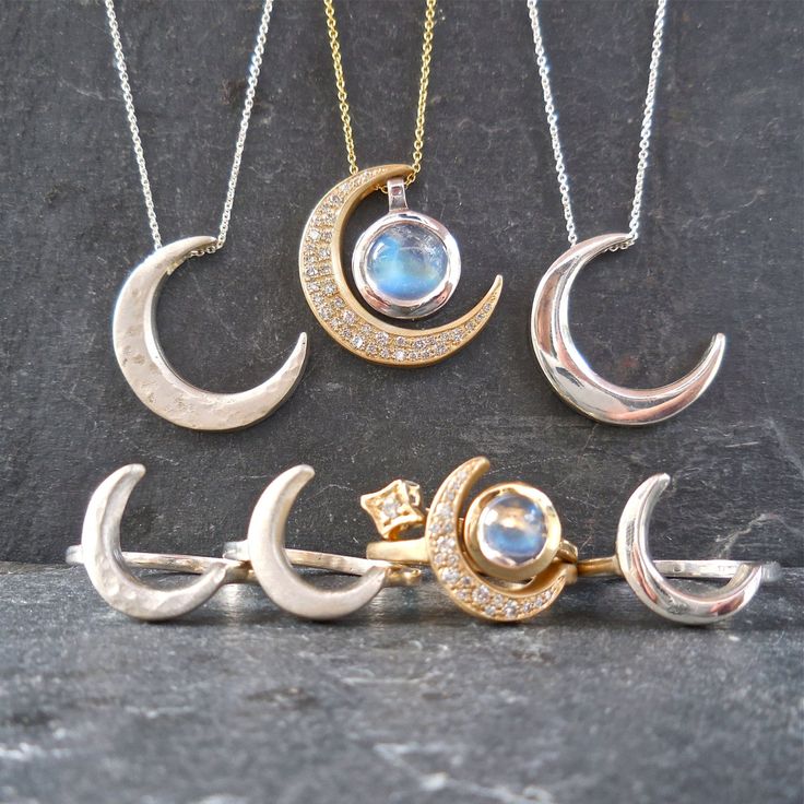 "This unique crescent moon phase pendant is available in silver or 14 k gold. So beautiful polished but equally stunning hand-finished matte, hammered or have it encrusted with diamonds. A focal piece that can be stacked with smaller pendants. It's a slide providing space for a pendant to fit into the opening. We've paired it with our bezel set moonstone. crescent moon 24 millimeters long x 19 mm wide or/ almost 1\" long x 3/4\" wide 14k solid gold or sterling silver pave Diamond encrusted Cresc Celestial Half Moon Jewelry For Anniversary, Luxury Sterling Silver Moon Charm Jewelry, Luxury Sterling Silver Jewelry With Moon Charm, Luxury White Gold Moon Charm Jewelry, Elegant Crescent Moonstone Jewelry, Luxury White Gold Jewelry With Moon Charm, Luxury Crescent-shaped White Gold Jewelry, Mystical Round Moon Charm Jewelry, Celestial Half Moon 14k Gold Jewelry