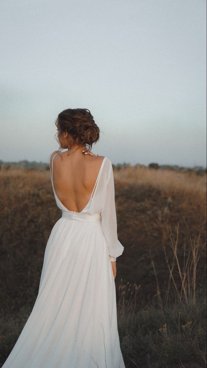 the back of a woman's dress in a field