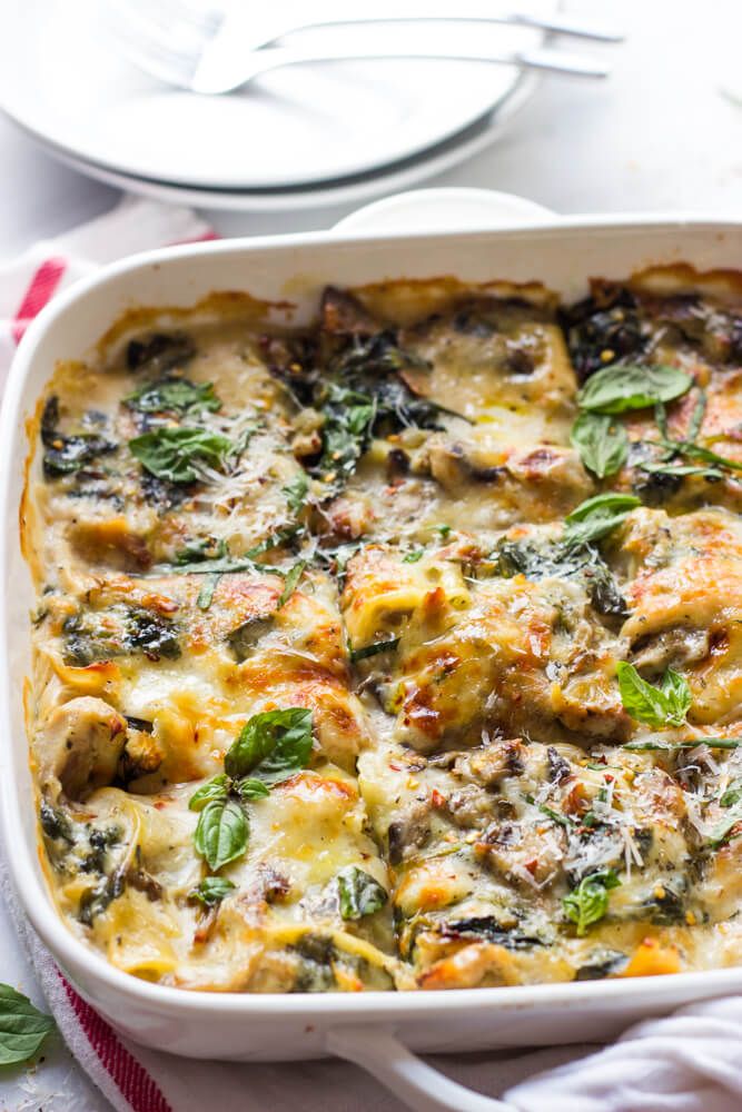 a casserole dish with spinach and cheese