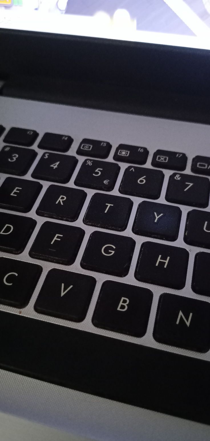 an open laptop computer sitting on top of a desk