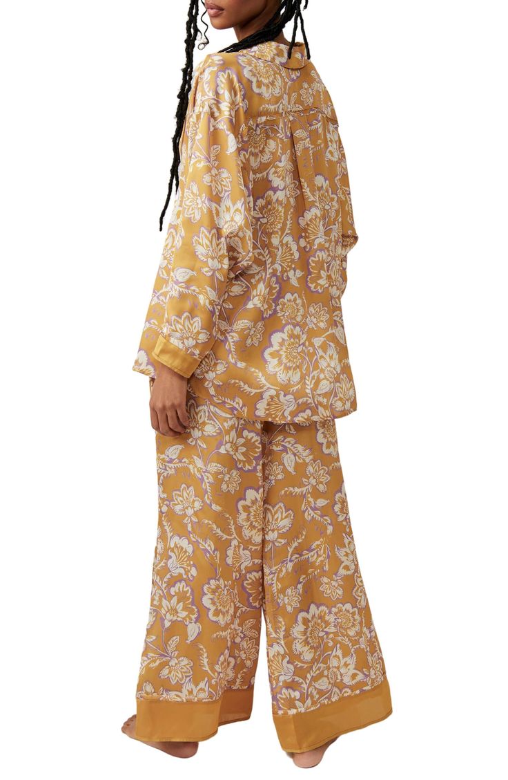 Make bedtime a bit more boho in flowery pajamas that live up to their dreamy designation. 28 1/2" to 31" top length; 28" inseam; 32" leg opening; 14" front rise; 17" back rise (size Medium) Top has spread collar; long sleeves 100% polyester Hand wash, line dry Imported Spring Matching Set Sleepwear, Spring Sleepwear With Relaxed Fit For Bedtime, Relaxed Fit Sleepwear For Spring Bedtime, Relaxed Fit Spring Sleepwear For Bedtime, Floral Print Sleepwear With Relaxed Fit Long Pants, Floral Print Relaxed Fit Sleepwear, Floral Print Sleepwear For Pajama Party, Floral Print Relaxed Fit Pajamas, Floral Print Relaxed Fit Long Sleepwear Pants