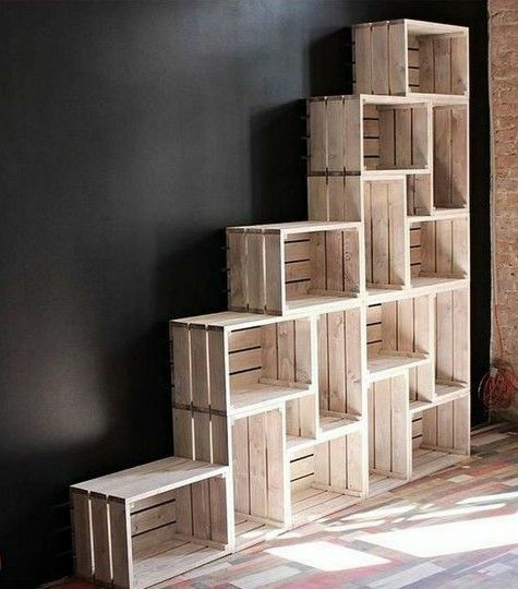 a stack of wooden crates sitting on top of a floor