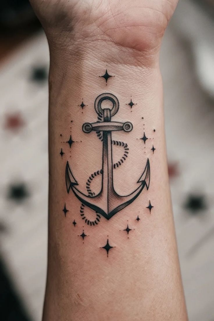 Anchor tattoo with rope detail, surrounded by small stars, on a forearm. Anchor Flower Tattoo, Anchor Tattoo Wrist, Nautical Symbols, Anchor Symbol, Unique Wrist Tattoos, Wrist Tattoo Ideas, Small Anchor, Anchor Tattoo Design, Sailor Tattoo