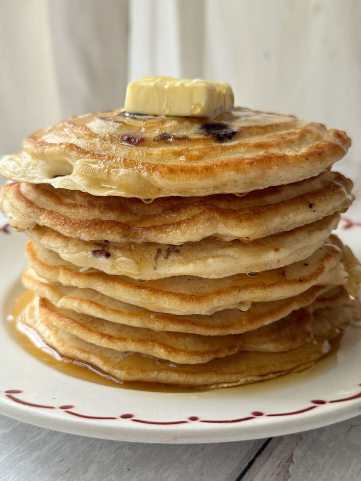 a stack of pancakes with butter on top