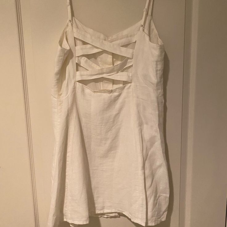 White Dress With Buttons Going Down The Front. Never Worn Before And Has The Tag Along With An Extra Button. White Casual Sundress With Adjustable Straps, Casual White Sundress With Adjustable Straps, Chic Cotton Sundress By Urban Outfitters, White Dress With Adjustable Straps For Daytime, Urban Outfitters Cotton Sundress For Vacation, White Buttoned Mini Dress For Vacation, Fitted White Sundress With Buttons, White Casual Dresses With Adjustable Straps, White Casual Dress With Adjustable Straps