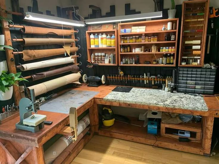 a workbench with lots of crafting supplies and tools on it's shelves