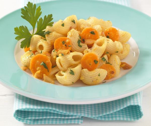 pasta with carrots and parsley on a blue plate