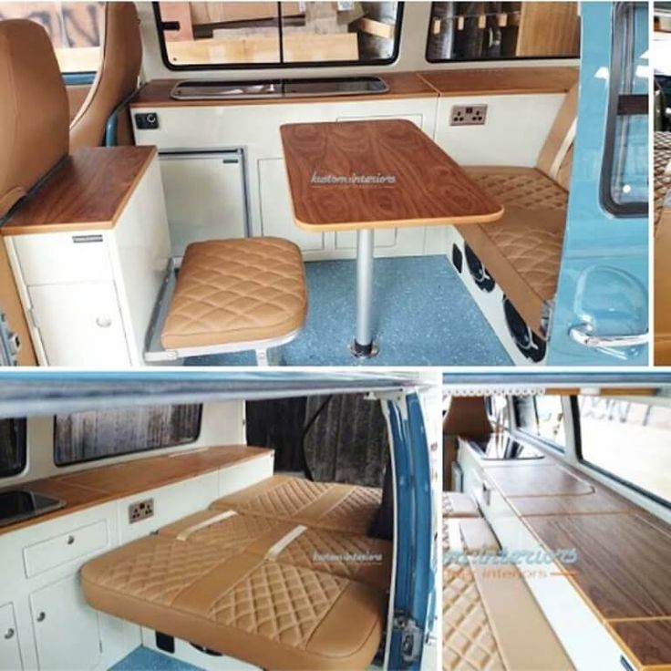 the interior of a camper van with wooden tables and benches on it's sides