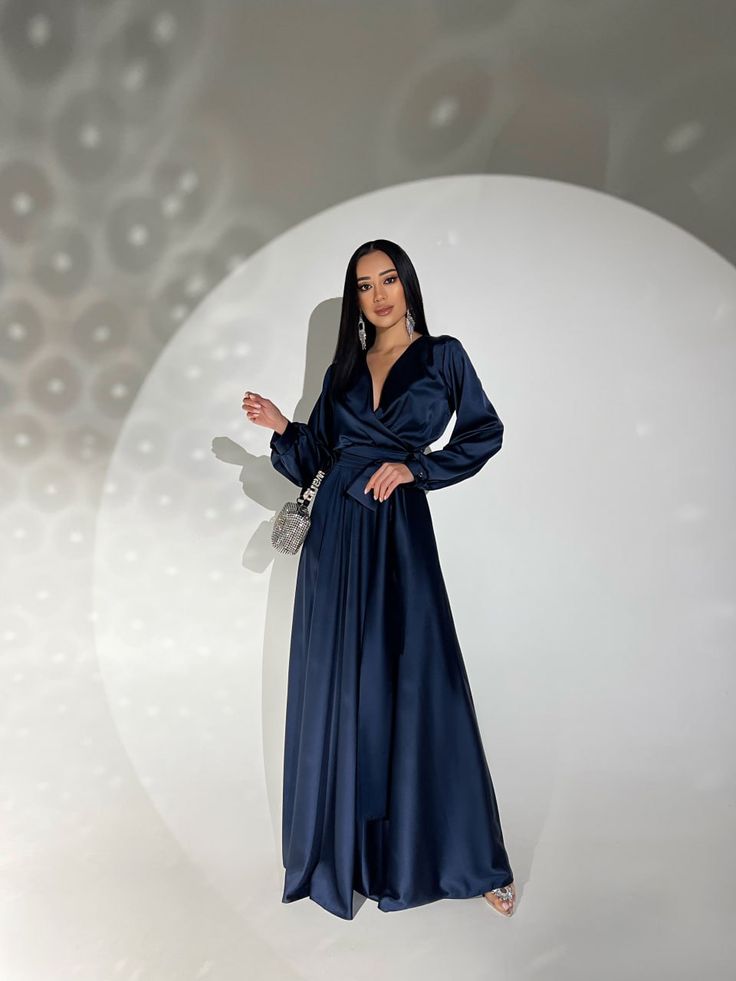 Fabric: Satin 60% polyester, 38% viscose, 2% elastane Longsleeve Maxi length V-neckline Wrap dress Belt included Dress length: 144 cm Sleeve length: 61 cm Color: white, black, beige, navy blue, emerald Size: S, M, L, XL V-neck Wrap Dress For Night Out In Fall, Elegant V-neck Dress With Surplice Neckline For Fall, Chic V-neck Wrap Dress For Cocktail, Blue V-neck Maxi Dress For Night Out, Chic V-neck Maxi Dress For Evening, Elegant Long Sleeve V-neck Dress For Night Out, Fitted Long Sleeve V-neck Dress For Evening, Fitted V-neck Long Sleeve Dress For Evening, Chic Long Sleeve V-neck Evening Dress