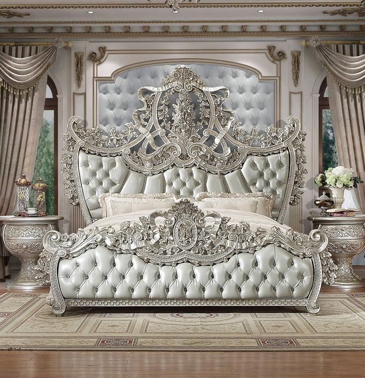 an ornately decorated bedroom with white furniture