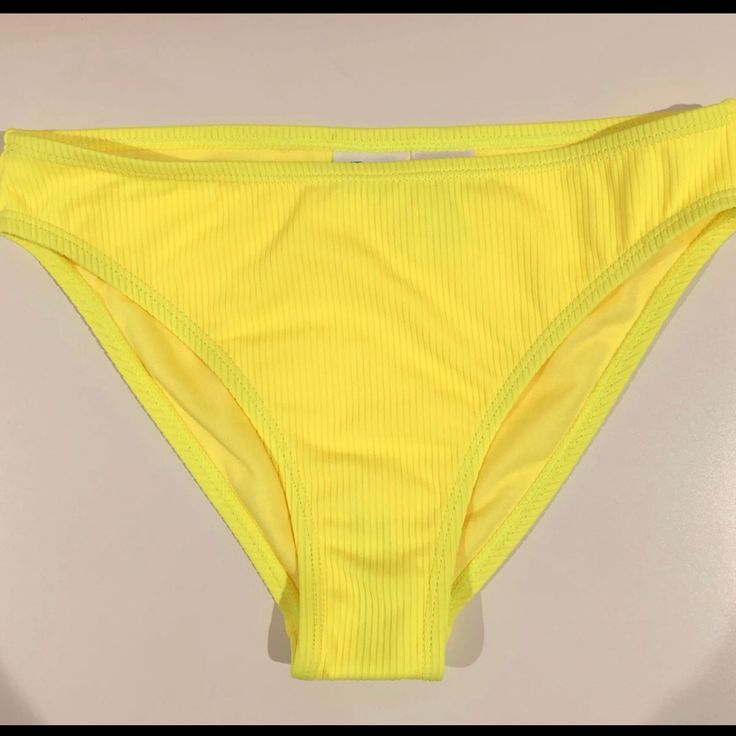 Brand New! Never Been Worn Bright Neon Yellow Bikini Bottom Summer Ribbed Poolside Bottoms, Ribbed Bottoms For Poolside Summer, Summer Ribbed Bottoms For Poolside, Ribbed Swimming Bottoms For Summer, Ribbed Bottoms For Beach Summer, Ribbed Beachwear Bottoms For Summer, Solid Ribbed Spring Swimwear, Summer Ribbed Swimwear For Spring, Ribbed Swimwear For Summer