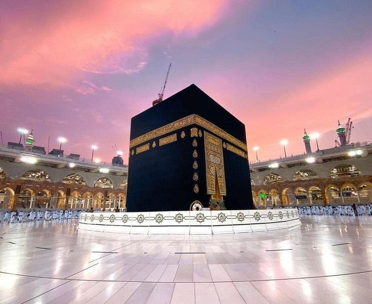 the ka'bah in the middle of a large building with lights on it