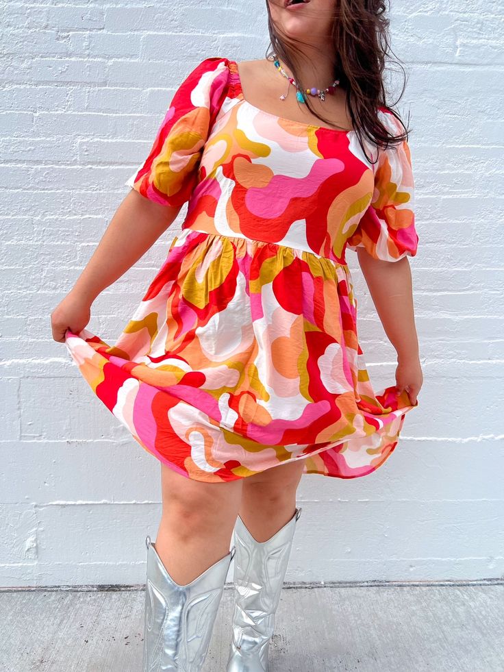 THE summer dress is here & ready to slay the season!! With the best warm tones and the cutest bow detail on the back, this dress is perfect for all occasions! Dress up with heels and jewelry, or keep it casual with sneakers and a cardigan! True to size. Self: 85% Rayon 15% Nylon Lining: 100% Polyester Puff sleeves and bow detail on the back Wear with sneakers, sandals, or heels Great length for our tall queens! Megan is 5'5 wearing a size 2X and typically wears a size 2X. Kristin is 5'10 and wea Businesses Photoshoot, Houston Photoshoot, Spring Color Combos, Tertiary Colors, Rainbow Closet, Bold Clothes, Colorful Photoshoot, Colorful Closet, Colorful Outfit Ideas